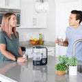 People using the Echo Hydrogen Water Pitcher in a modern kitchen for enhanced hydration and antioxidant support.