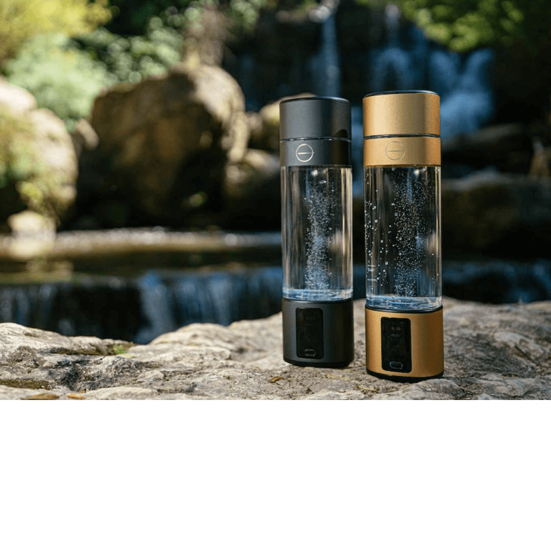 Lumivitae Cell Power Hydrogen Water Bottles by a waterfall, showcasing ergonomic design and advanced hydrogen infusion technology.