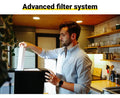 Man using RKIN U1 Countertop Reverse Osmosis Water Filter in a modern kitchen with advanced filter system.