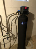 SpringWell Whole House Iron Filter for Well Water installed in a home basement, showcasing advanced filtration technology.