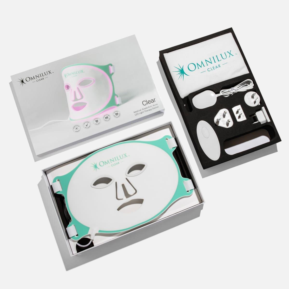 Omnilux Clear LED light therapy mask with accessories in open packaging, best red light therapy mask in Canada.